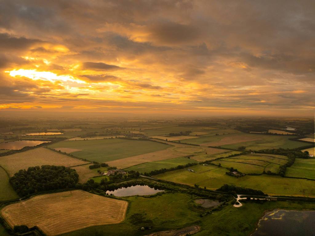 Thornborough henges from the north west at the summer solstice